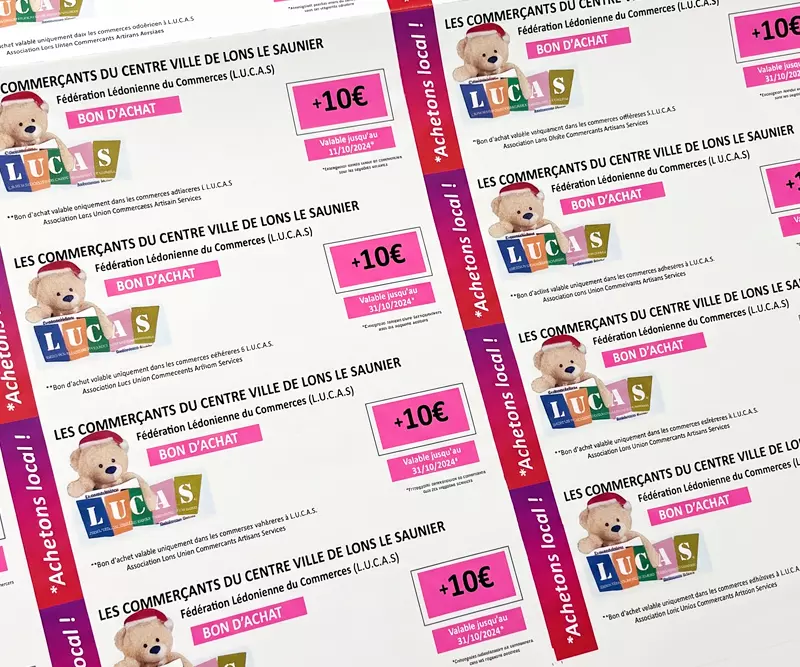 Feuille imprimée de bons d'achat de 10 euros pour les commerçants de Lons-le-Saunier, avec ours illustré